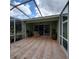 Relaxing screened patio with seating area, overlooking backyard at 20841 Eustis Rd, Land O Lakes, FL 34637