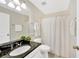 Clean bathroom with granite countertop and shower/tub at 2357 Emerald Lake Dr, Sun City Center, FL 33573