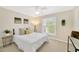 Bright bedroom with plantation shutters and neutral decor at 2357 Emerald Lake Dr, Sun City Center, FL 33573
