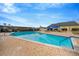 Relaxing outdoor pool with surrounding patio at 2357 Emerald Lake Dr, Sun City Center, FL 33573