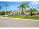 Single-Gathering home with palm trees and manicured lawn at 2357 Emerald Lake Dr, Sun City Center, FL 33573
