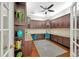 Bright home office features built-in cabinetry and hardwood floors at 2357 Emerald Lake Dr, Sun City Center, FL 33573