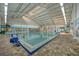Heated indoor pool with a lift and ample seating at 2357 Emerald Lake Dr, Sun City Center, FL 33573