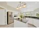 Modern kitchen with stainless steel appliances and granite countertops at 2357 Emerald Lake Dr, Sun City Center, FL 33573