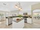 Spacious kitchen with island, stainless steel appliances, and granite countertops at 2357 Emerald Lake Dr, Sun City Center, FL 33573