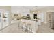 Eat-in kitchen with breakfast bar and view of living room at 2357 Emerald Lake Dr, Sun City Center, FL 33573