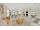 Open concept living and dining area with neutral color palette and plenty of natural light at 2357 Emerald Lake Dr, Sun City Center, FL 33573
