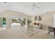 Open living room with sliding doors leading to the pool at 2357 Emerald Lake Dr, Sun City Center, FL 33573