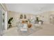 Bright living room featuring comfortable seating, stylish decor, and large windows at 2357 Emerald Lake Dr, Sun City Center, FL 33573