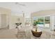 Living room with access to the pool and a view to the dining area at 2357 Emerald Lake Dr, Sun City Center, FL 33573