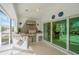 Outdoor kitchen with stainless steel appliances and a tiled counter at 2357 Emerald Lake Dr, Sun City Center, FL 33573