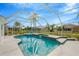 Relaxing screened-in pool and spa, perfect for outdoor entertaining at 2357 Emerald Lake Dr, Sun City Center, FL 33573