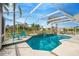 Inviting screened pool and spa with patio furniture at 2357 Emerald Lake Dr, Sun City Center, FL 33573