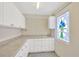 Workshop area with ample storage and pegboard at 2357 Emerald Lake Dr, Sun City Center, FL 33573