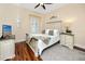 Bright bedroom with a queen-size bed and wood floors at 2670 Tanglewood Trl, Palm Harbor, FL 34685