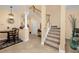 Bright and airy entryway with staircase and high ceilings at 2670 Tanglewood Trl, Palm Harbor, FL 34685