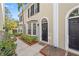 Tan colored townhouses with black doors and manicured landscaping at 2802 W Cleveland St # D, Tampa, FL 33609