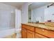Clean bathroom with granite countertop and tiled shower/tub combo at 3000 Red Oak Court # 103, Palm Harbor, FL 34684