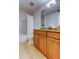 Updated bathroom with granite vanity and tiled flooring at 3000 Red Oak Court # 103, Palm Harbor, FL 34684