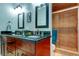Double vanity bathroom with granite countertops and tiled shower at 3000 Red Oak Court # 103, Palm Harbor, FL 34684