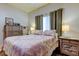 Charming bedroom with double bed, and neutral color scheme at 3000 Red Oak Court # 103, Palm Harbor, FL 34684