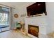 Electric fireplace with mantel and built-in shelving at 3000 Red Oak Court # 103, Palm Harbor, FL 34684