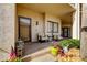 Inviting front porch with seating and landscaping at 3000 Red Oak Court # 103, Palm Harbor, FL 34684