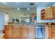 Kitchen with granite countertops and island at 3000 Red Oak Court # 103, Palm Harbor, FL 34684