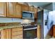Stainless steel appliances and wood cabinets at 3000 Red Oak Court # 103, Palm Harbor, FL 34684