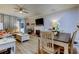 Spacious living room with fireplace, comfortable seating, and dining area at 3000 Red Oak Court # 103, Palm Harbor, FL 34684