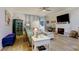 Living area features a fireplace and plenty of natural light at 3000 Red Oak Court # 103, Palm Harbor, FL 34684