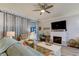 Living room with fireplace, comfortable seating, and large TV at 3000 Red Oak Court # 103, Palm Harbor, FL 34684