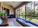 Relaxing screened porch with patio furniture and kayak at 3000 Red Oak Court # 103, Palm Harbor, FL 34684