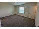 Bright bedroom with neutral carpeting and window blinds at 32174 Turtle Grace Loop, Wesley Chapel, FL 33545