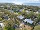 Aerial view of a home with a large yard, near the water at 3613 S Gardenia Ave, Tampa, FL 33629
