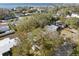 An aerial shot showing a house surrounded by lush trees near the coast at 3613 S Gardenia Ave, Tampa, FL 33629