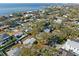 Aerial view of a house close to the water, surrounded by trees at 3613 S Gardenia Ave, Tampa, FL 33629