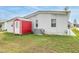 Property features a detached shed and grassy backyard at 36901 Kimela Ave, Zephyrhills, FL 33542
