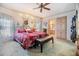 Spacious Primary bedroom with king-size bed and ensuite bathroom access at 36901 Kimela Ave, Zephyrhills, FL 33542
