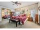 Large bedroom with king-size bed and mirrored closet doors at 36901 Kimela Ave, Zephyrhills, FL 33542