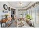 Sunlit dining area with table and chairs near kitchen at 36901 Kimela Ave, Zephyrhills, FL 33542