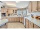 Spacious kitchen with ample cabinetry and corner sink at 36901 Kimela Ave, Zephyrhills, FL 33542