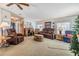 Spacious living area with comfortable seating and ceiling fan at 36901 Kimela Ave, Zephyrhills, FL 33542