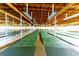 Indoor shuffleboard courts with benches and lighting at 36901 Kimela Ave, Zephyrhills, FL 33542