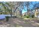 Townhouse back with screened patio and lawn at 37650 Aaralyn Rd, Zephyrhills, FL 33542