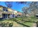 Townhouse back with screened patio and lawn at 37650 Aaralyn Rd, Zephyrhills, FL 33542