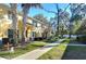 Landscaped backyard with a view of neighboring homes and trees at 37650 Aaralyn Rd, Zephyrhills, FL 33542
