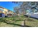 Townhouse back with screened patio and lawn at 37650 Aaralyn Rd, Zephyrhills, FL 33542