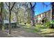Townhouse back with screened patio and lawn at 37650 Aaralyn Rd, Zephyrhills, FL 33542
