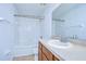 Clean bathroom with tub, shower, toilet and wood vanity at 37650 Aaralyn Rd, Zephyrhills, FL 33542